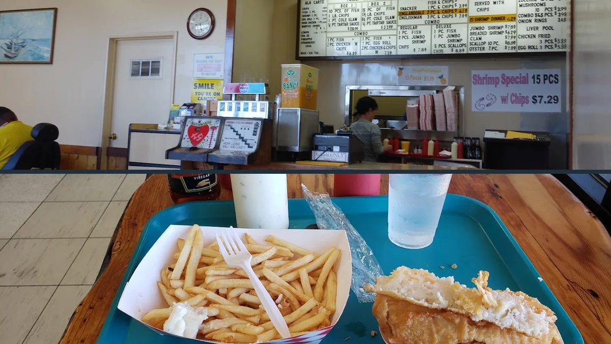 Fish and chips served on a simple plate.